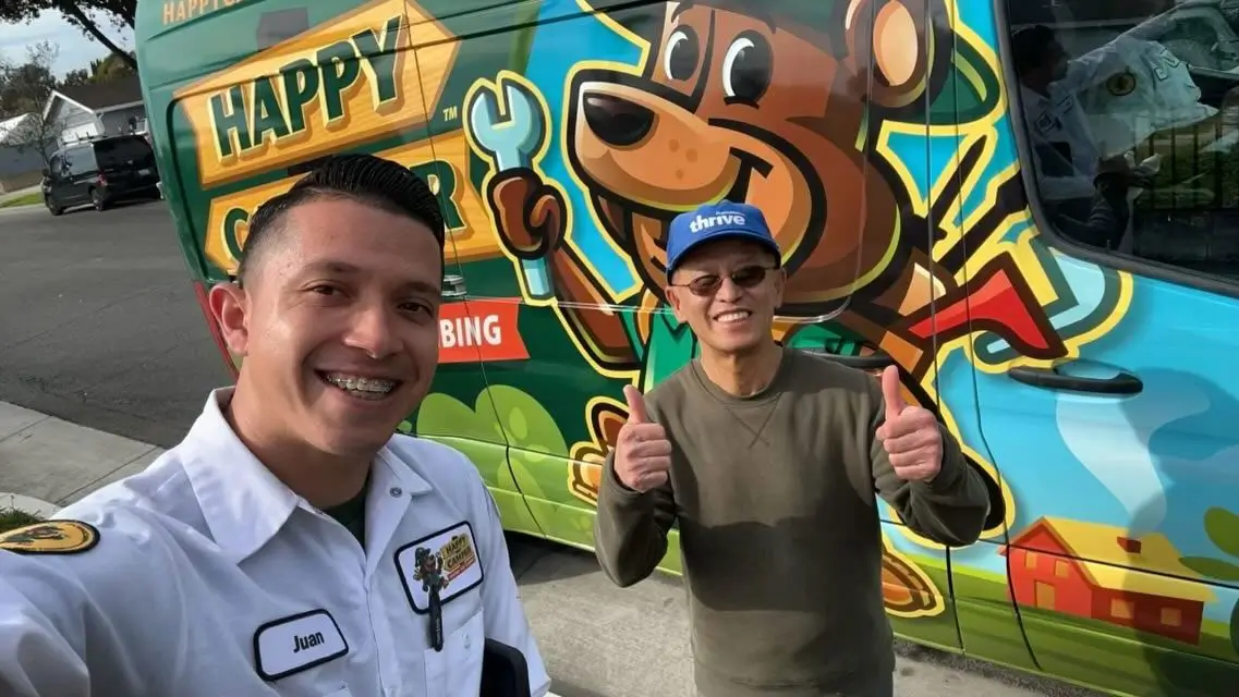 Technician and customer thumbs up
